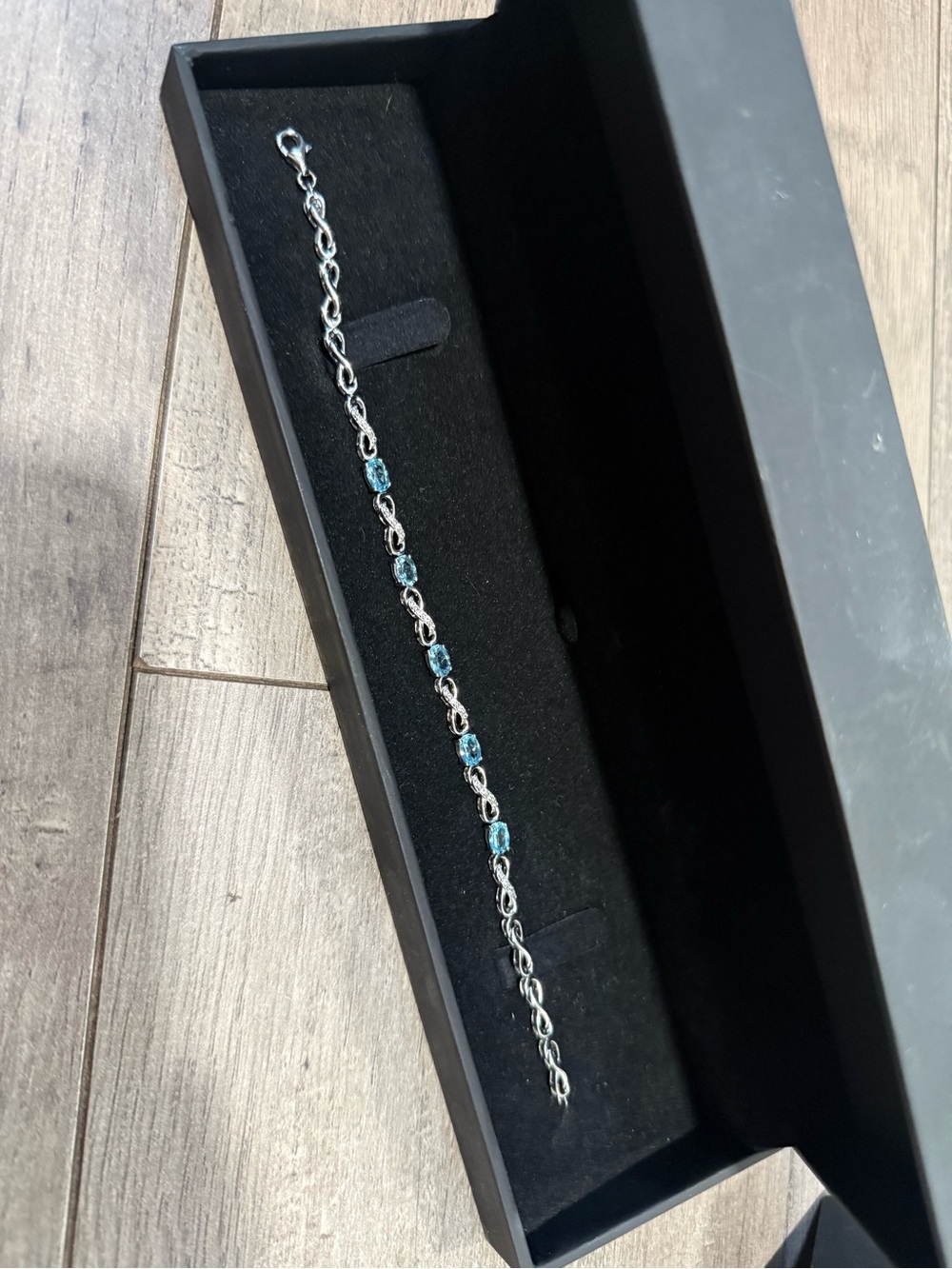 Oval cut natural Swiss blue topazwhite lab created sapphire infinity bracelet
